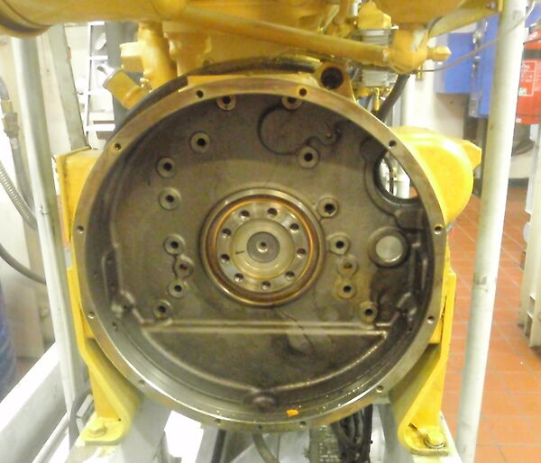 Flywheel housing and in the centre the rear main seal