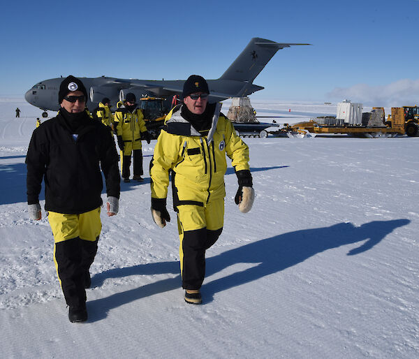 The Governor General (right) and Australian Antarctic Division Director Dr Nick Gales at Wilkins Aerodrome with the C17-A aircraft behind them.