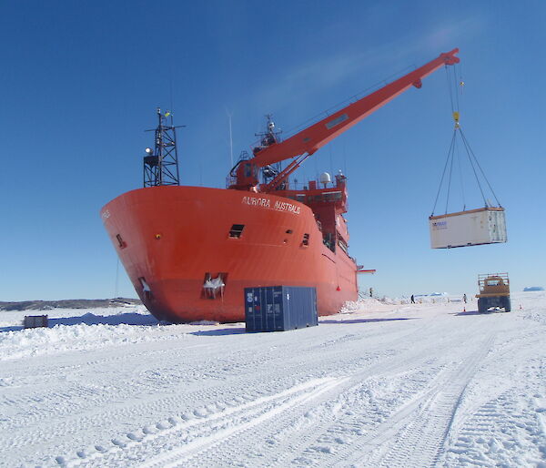The Aurora Australis unloads cargo on the fast ice at Davis station.