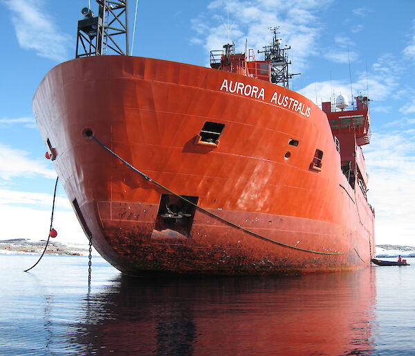 The bow of the Aurora Australis with lines running from the ship