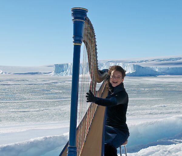 Harpist Alice Giles playing her harp on the sea ice
