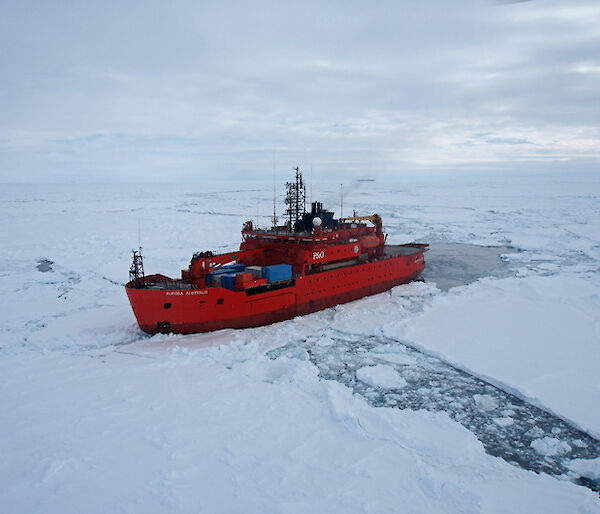 The Aurora Australis parked beside an ice floe