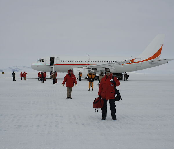 Antarctic Division personnel disembarking the A319 aircraft on the ice at McMurdo station