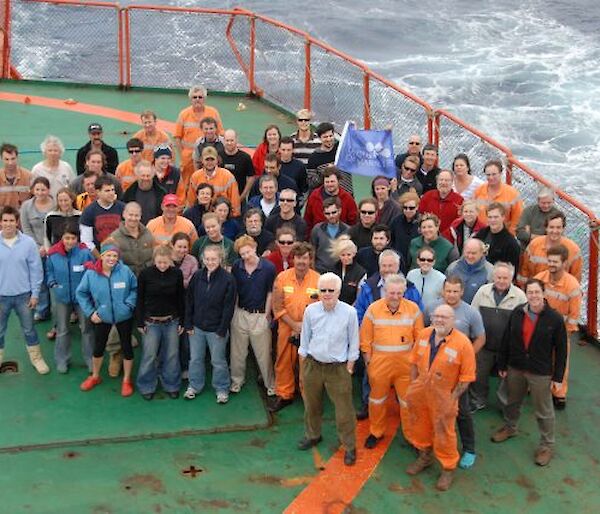 Group of expeditioners on the heli deck of the Aurora Australis.
