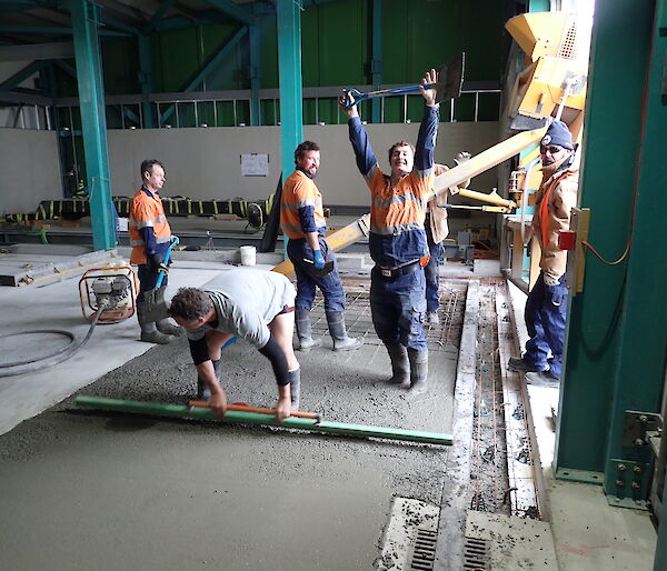 Tradesmen working on a concrete slab