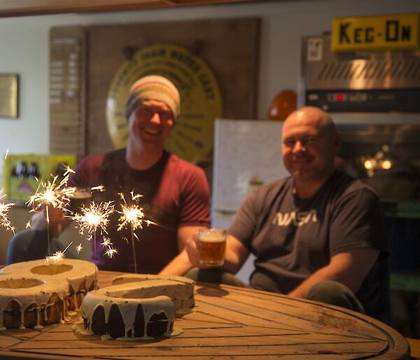 Rich (and Rob with their birthday cake with sparklers