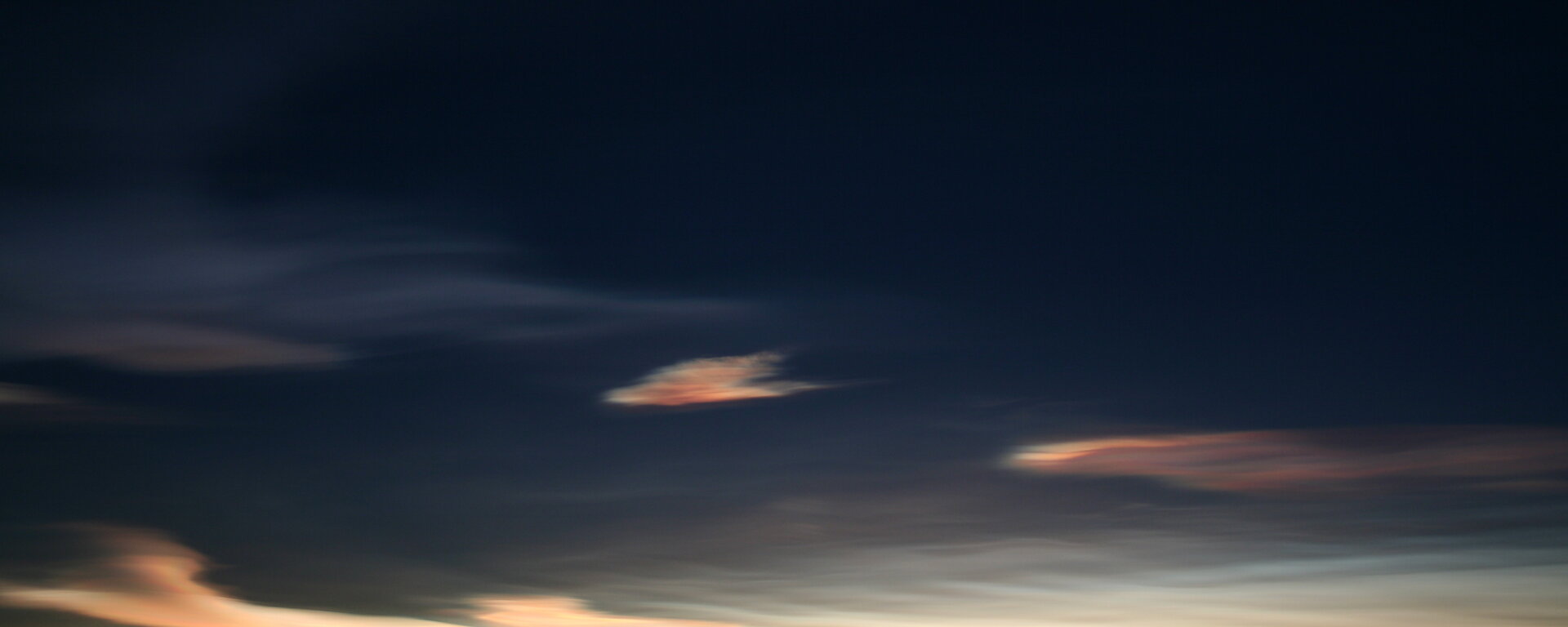 Multicoloured clouds at fading light during sunset