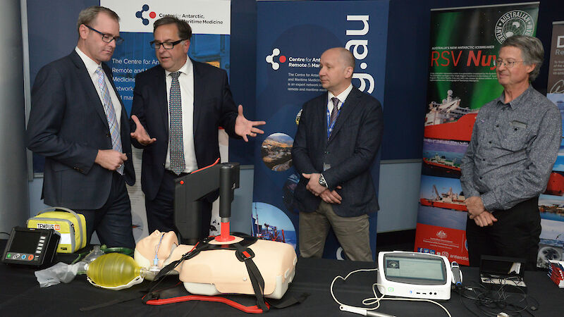 Dr Jeff Ayton (second left) explains some of the medical equipment used at Antarctic stations to the Tasmanian Minister for Health, Michael Ferguson (left), while doctors from the Antarctic Division’s Polar Medicine Unit, Roland Watzl and Clive Strauss look on.