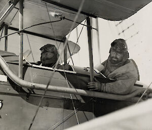 Two men in a small light aircraft