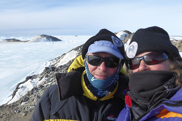 Scientists Colin and Louise stand atop their rocky island office