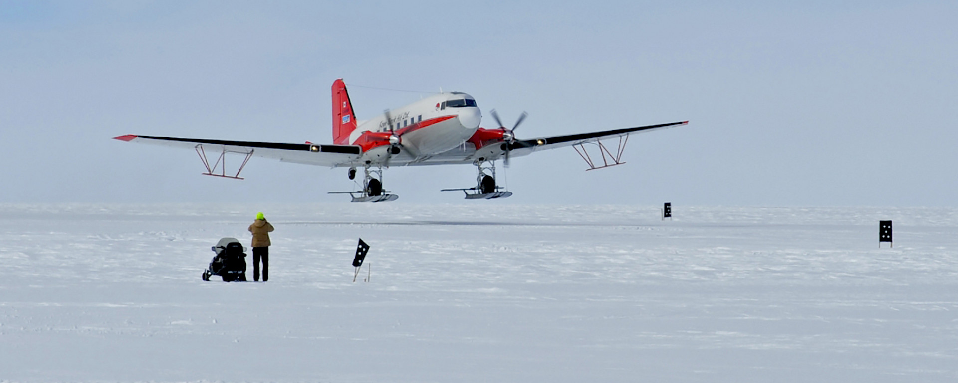 The 72 year old Basler BT-67 aircraft with its wing-mounted, ice penetrating radar antennae.