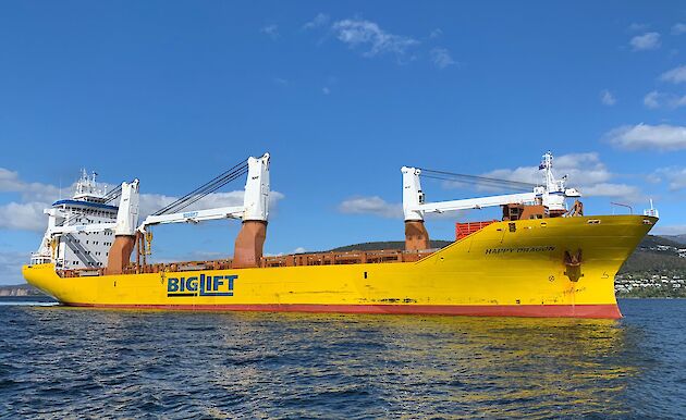 yellow cargo ship in river