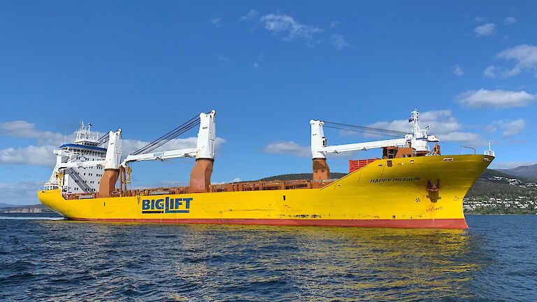 yellow cargo ship in river