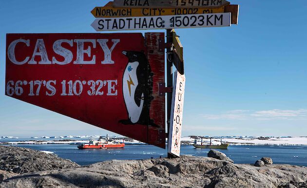 Casey sign in foreground with two ships in background