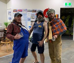 Three expeditioners in fun costumes for a murder mystery night