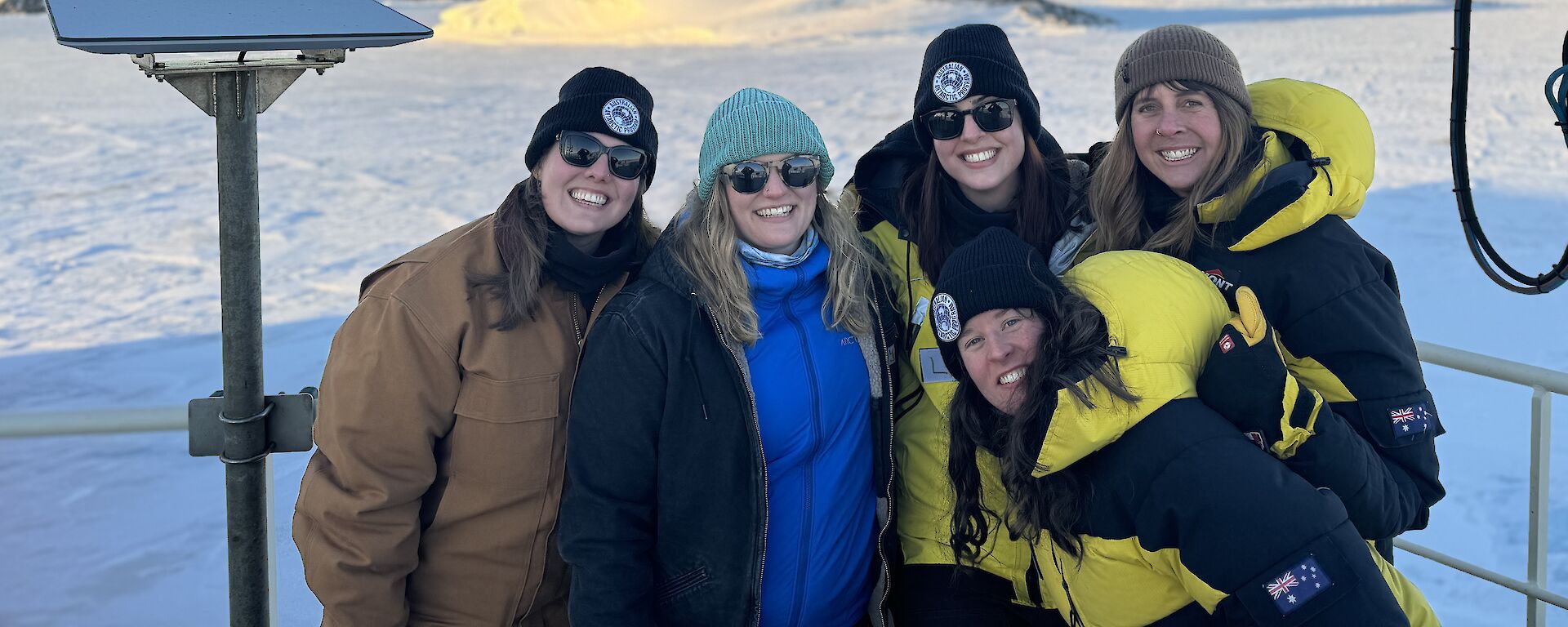 Five female expeditioners arriving at Davis Station on RSV Nuyina.