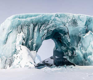A jade iceberg in the shape of an arch.
