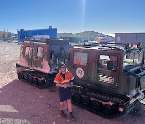 Chris in the foreground, the newest Hagglund of the fleet in the background - a shiny dark army green Hagglund