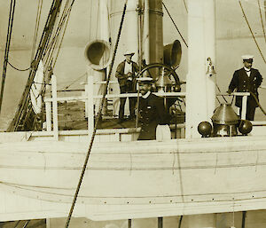 Sepia toned photos of a man in uniform standing on the deck of a boat