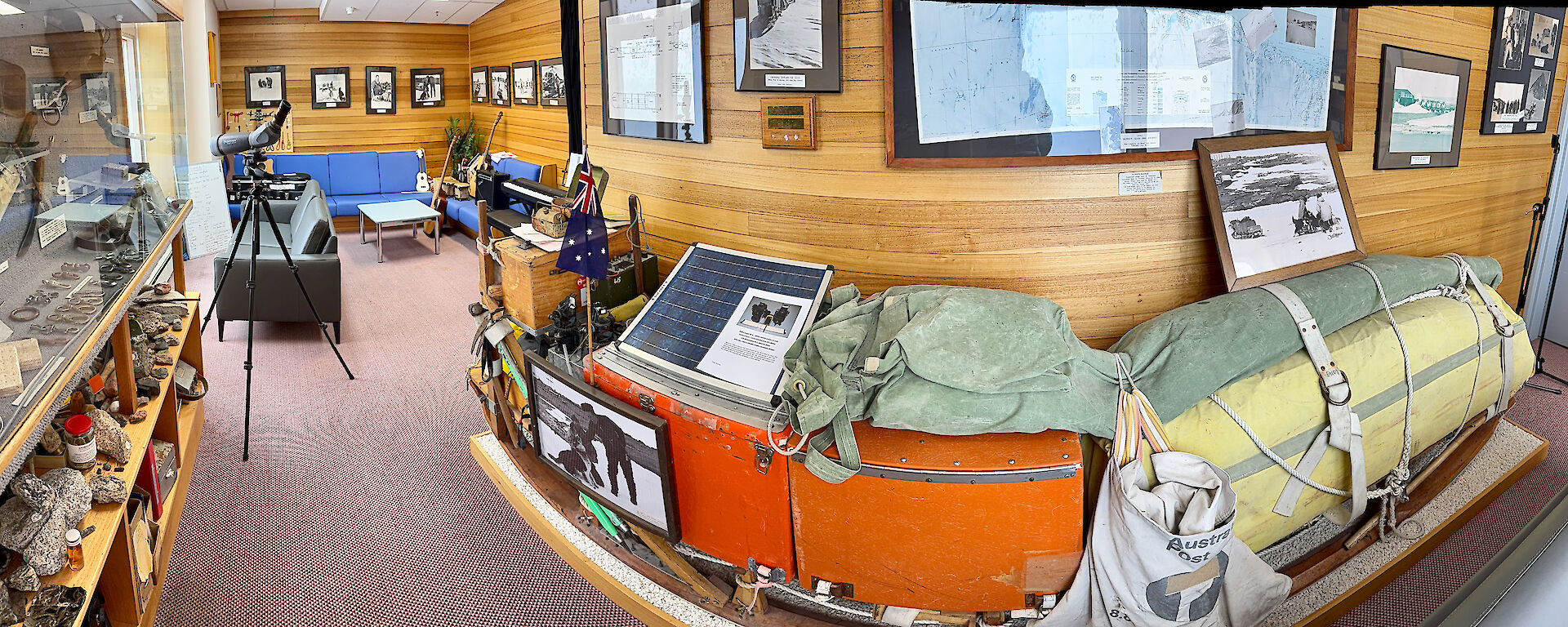 a panoramic view of Mawson's Dog Room which is full of historic ANARE memorabilia and displays, including an original dog sled