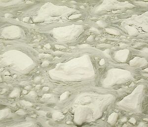 A greenish slush of broken-up sea ice floes