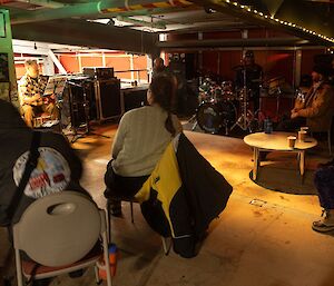 A band playing in a darkened room