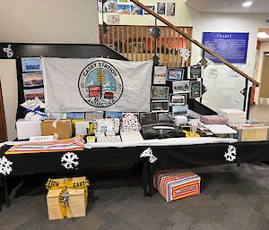 A table covered with brightly wrapped boxes and envelopes.