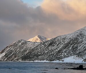 View of snow-covered mountains past Landing Beach