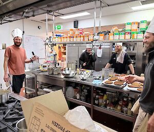 A group of people in the kitchen