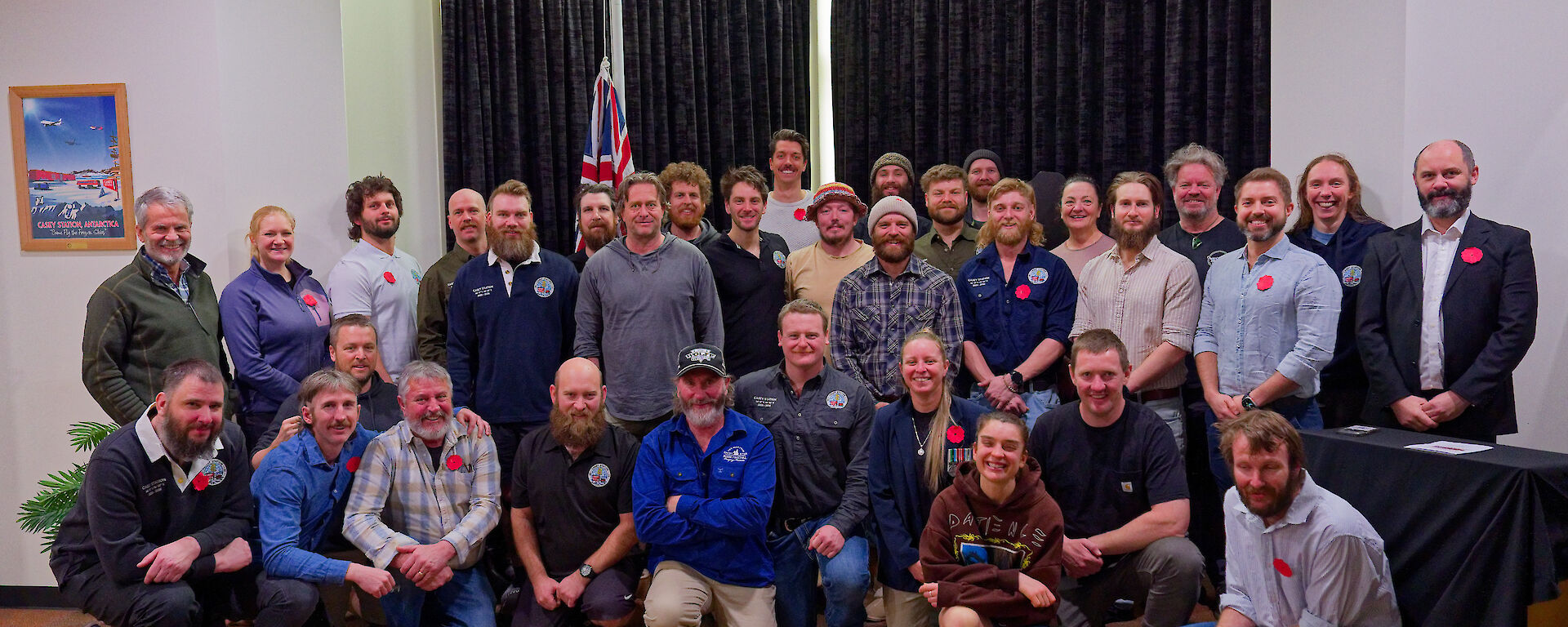 A group of smiling people in a room