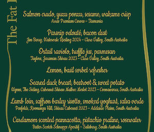A green menu with gold writing
