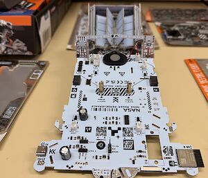 A picture of the parts of a model Mars Rover - not yet fully assembled
