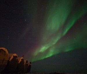 A blurry picture with aurora slightly visible in the sky