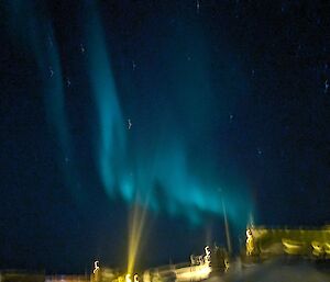 A blurry picture with aurora slightly visible in the sky