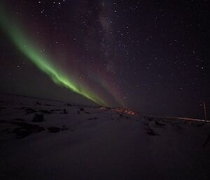 A blurry picture with aurora slightly visible in the sky