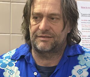 a man wearing a blue shirt