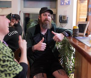 a man giving two thumbs up