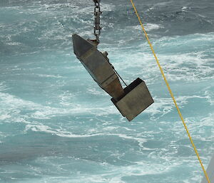 A metal box going into the ocean
