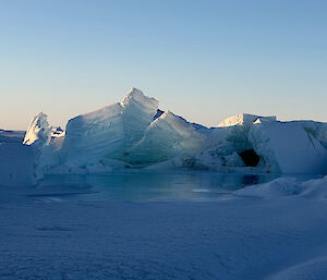 Picture of almost transparent ice features protruding from the sea ice