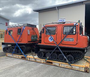 An orange snow tractor