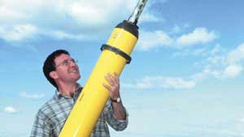 Scientist holding an Argo buoy