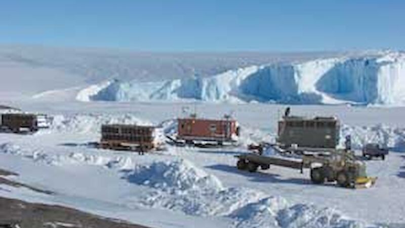 Vans and sleds being prepared for the expedition