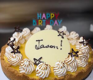 A picture of a lemon meringue tart birthday cake