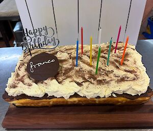 A picture of a birthday tiramisu cheesecake