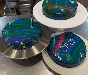 A picture of three aurora-themed birthday mud cakes