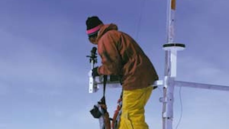 Expeditioner setting up an Automatic Weather Station