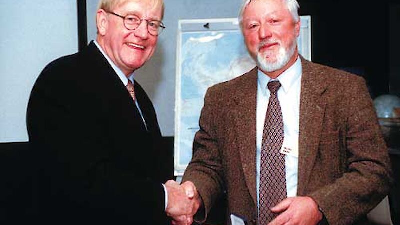 Senator Ian McDonald (at the time Parliamentary Secretary responsible for Australia’s Antarctic Program) congratulates Martin Betts on his Australian Antarctic Medal award.