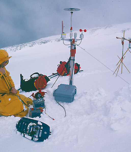 Expeditioner setting up climate data collection instruments