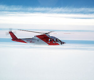 Helicopter flying over icy landscape during an aerial survey