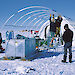 Expeditioners assemble a plant and equipment shelter for the AMISOR hot water drill